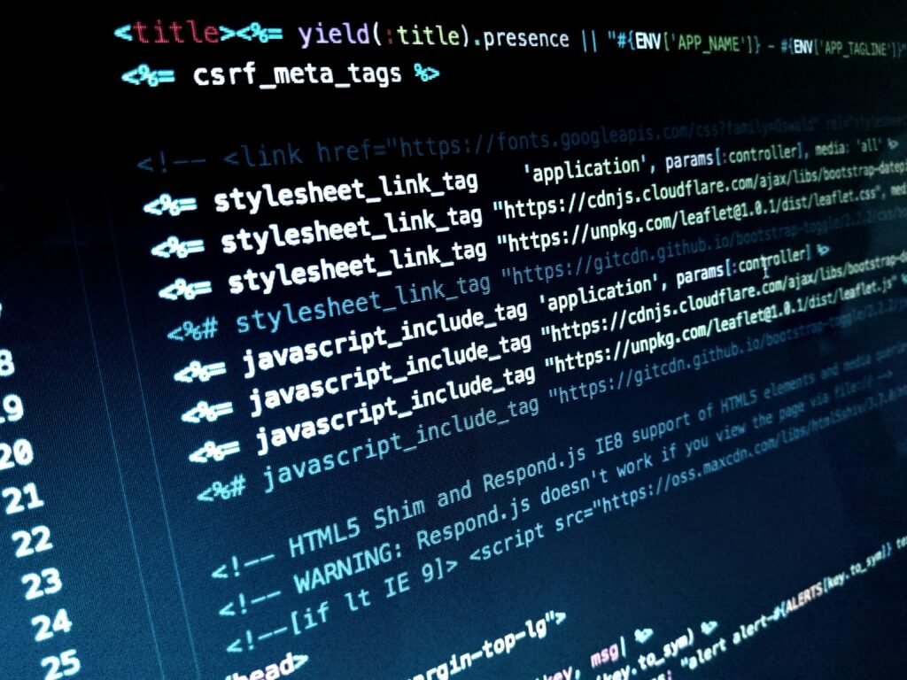 Professional Web Application Development Services 4 Detailed view of HTML and JavaScript code displayed on a computer monitor.
